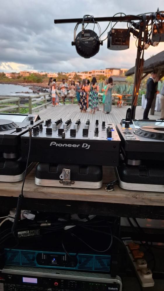 Beachfront DJ setup at sunset
